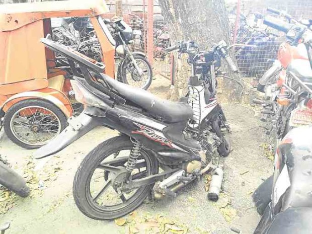 The motorcycle used by the victims of the Feb. 12 hit-and-run incident was almost broken in two. —JHESSET ENANO