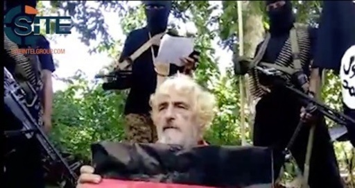 In this undated image made from militant video and released by SITE Intel Group on Feb. 24, 2017, shows German hostage Jurgen Gustav Kantner at an undisclosed location. Abu Sayyaf extremists in the Philippines have released a video of the beheading of Kantner. The brief video circulated Monday, Feb. 27, by the SITE Intelligence Group, which monitors jihadi websites, is the first sign that the brutal militants proceeded with their threat to kill Kantner in the southern Philippines after a Sunday ransom deadline lapsed. (SITE Intel Group via AP)