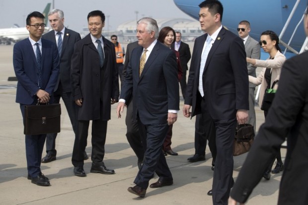 US Secretary of State Rex Tillerson (C) arrives at Beijing Capital International Airport on March 18, 2017.  / AFP PHOTO / POOL / Mark Schiefelbein
