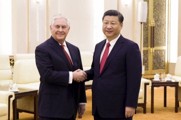 China's President Xi Jinping (R) shakes hands with US Secretary of State Rex Tillerson (L) before their meeting at the Great Hall of the People in Beijing on March 19, 2017. Tillerson met Xi on March 19 just hours after a North Korean rocket engine test added new pressure on the big powers to address the threat from Pyongyang. / AFP PHOTO / POOL / THOMAS PETER