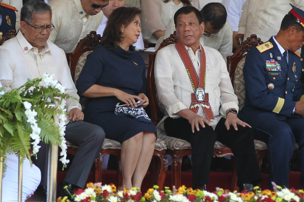 President Rodrigo Roa Duterte chats with Vice President Maria Leonor Robredo at the sidelines of the 38th Philippine National Police Academy (PNPA) Commencement Exercises for 'Masidlak' Class of 2017 at Camp General Mariano N. Castañeda in Silang, Cavite on March 24, 2017. Also in the photo is Interior and Local Government Secretary Ismael Sueno. KING RODRIGUEZ/Presidential Photo