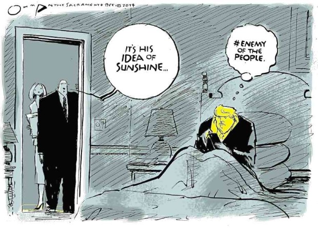 Cartoon by Jack Ohman of The Sacramento Bee in March —AP