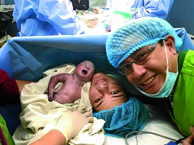 DIGONG’S ‘APO’ Davao City Mayor Sara Duterte-Carpio gives birth to President Duterte’s 10th grandchild via cesarean section. With them is Sara’s husband, lawyer Manases Carpio. —PHOTO COURTESY OFDAVAOCITY INFORMATION OFFICE