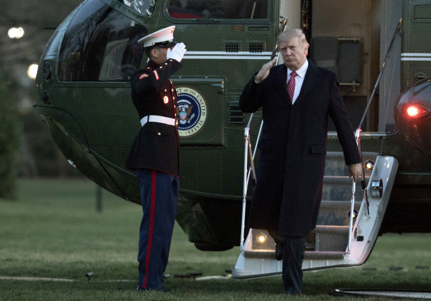 President Donald Trump salutes as he disembarks Marine One upon arrival at the White House in Washington, Sunday, March 5, 2017. (AP Photo/Manuel Balce Ceneta)