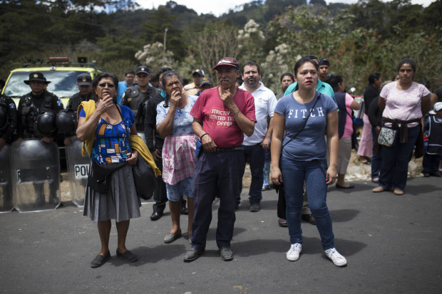 Relatives wait outside the Virgen de la Asunción children's shelter, in San Jose Pinula, Guatemala, on Wednesday, March 8, 2017. At least 19 people have been found dead after a fire at the shelter, which was created to house children who were victims of abuse, homelessness or who had completed sentences at youth detention centers and had nowhere else to go, the spokesman for Guatemala's volunteer fire departments said. (AP Photo / Luis Soto)