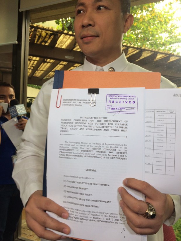 Magdalo Partylist Rep. Gary Alejano shows to reporters the impeachent case he filed against President Duterte on Mar. 16, 2017. (PHOTO BY NIÑO JESUS ORBETA / INQUIRER)