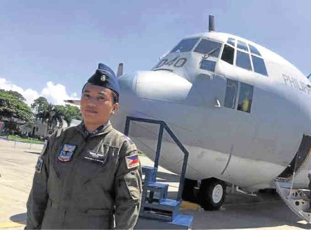 Maj. Marjorie Mukay before one of the PAF’s Lockheed C-130 Hercules planes. —CONTRIBUTED PHOTO
