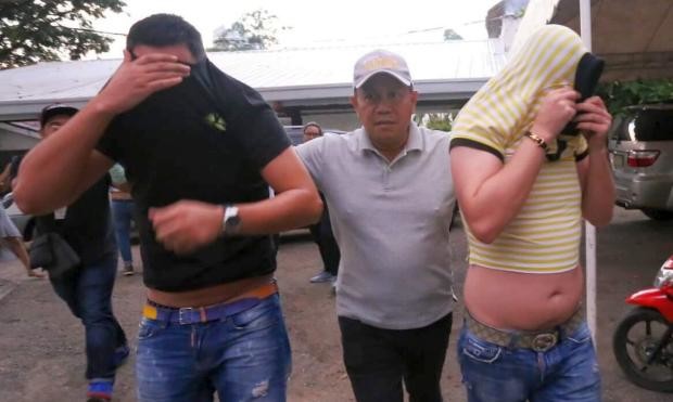 NBI agent escorts 2 of 3 Romanians suspected of ATM skimming - 17 March 2017