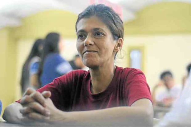 CAPTIVE AUDIENCE  Veronica Sevilla listens intently during a drug rehab session inside a church in Blumentritt.