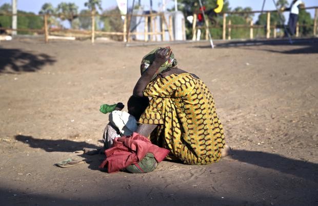 South Sudanese refugee woman with child in Uganda - 16 Feb 2017