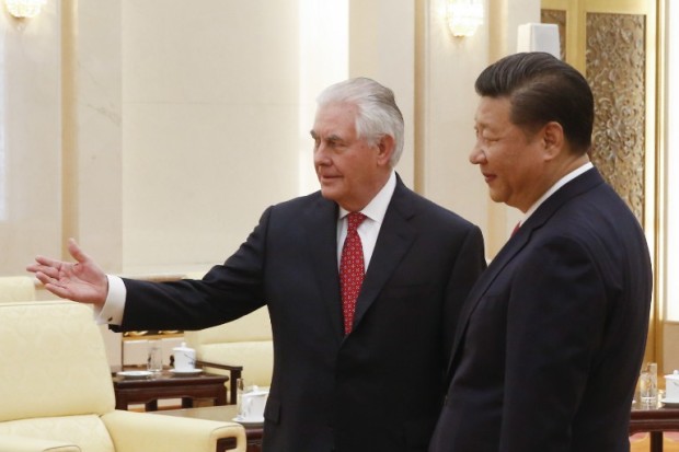 China's President Xi Jinping (R) meets US Secretary of State Rex Tillerson (L) at the Great Hall of the People in Beijing on March 19, 2017. Tillerson met Xi on March 19 just hours after a North Korean rocket engine test added new pressure on the big powers to address the threat from Pyongyang. / AFP PHOTO / POOL / THOMAS PETER