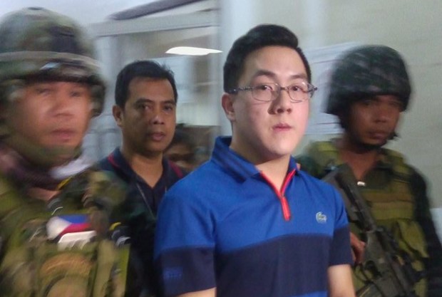 Cebu road suspect David Lim Jr.  is escroted to the stockade of the Cebu City Police Office  after CCPO director, Senior Supt. Joel Doria turned down the request of Lim’s lawyer to return him to the Police Regional Office in Central Visayas where he surrendered early Tuesday. -Junjie Mendoza, CDN