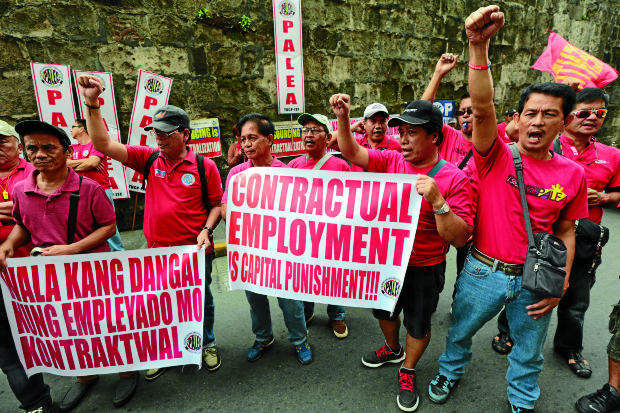 NO TO CONTRACTUALIZATION  Workers protest the government’s contractualization policy even as Labor Secretary Silvestre Bello III signs a new order banning “endo.”  —GRIG C. MONTEGRANDE