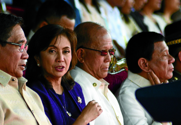 President Duterte led this year's graduation rites at the Philippine Military Academy for the first time on Sunday (March 12), accompanied by Vice President Leni Robredo. They were separated by Defense Secretary Delfin Lorenzana. During his speech, the President apologized for forgetting to acknowledge Robredo, and blamed his speech writer.PHOTO BY EV ESPIRITU