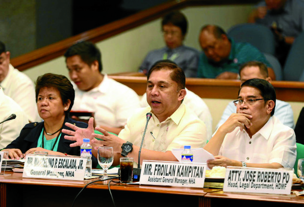 SENATE INQUIRY National Housing Authority General Manager Marcelino Escalada Jr. and other officials attend a hearing called by a Senate committee looking into the occupation of government housing sites by informal settlers. —LYN RILLON