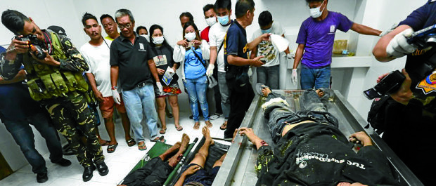 ABU DEATHS The unidentified bodies of three more suspected Abu Sayyaf bandits killed in a clash with government troops in Clarin, Bohol, were brought to the town’s funeral parlor. —JUNJIE MENDOZA/CEBU DAILY NEWS