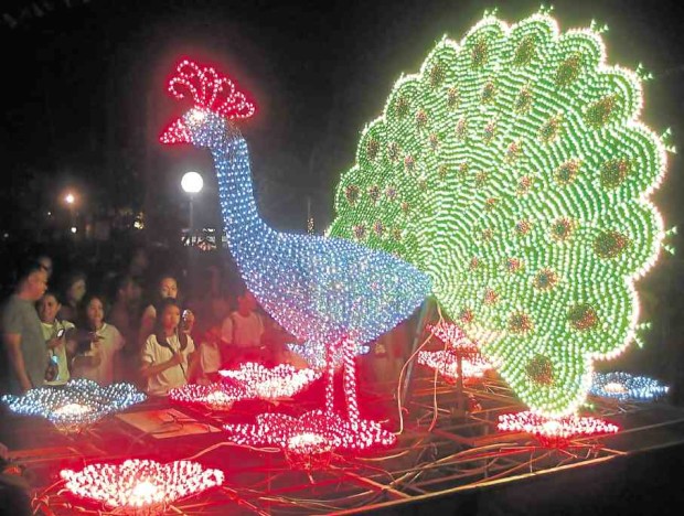 COLOR BURST A parade of floats carrying images of animals, sea creatures and flowers lighted by multicolored bulbs is among the highlights of this year's Capiztahan Festival in Capiz province.—NESTOR P. BURGOS JR.