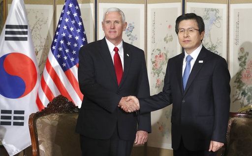 FILE - In this April 17, 2017, file photo Vice President Mike Pence, left, poses with South Korea's acting President and Prime Minister Hwang Kyo-ahn for a photo before their meeting in Seoul, South Korea. Vice President Mike Pence’s 10-day, four nation visit to Asia has offered evidence that Pence is becoming one of President Donald Trump's main emissaries on the global stage, patching up relations, reassuring allies who wonder about Trump's unpredictable ways and diving into international crises like North Korea. (AP Photo/Lee Jin-man, File)