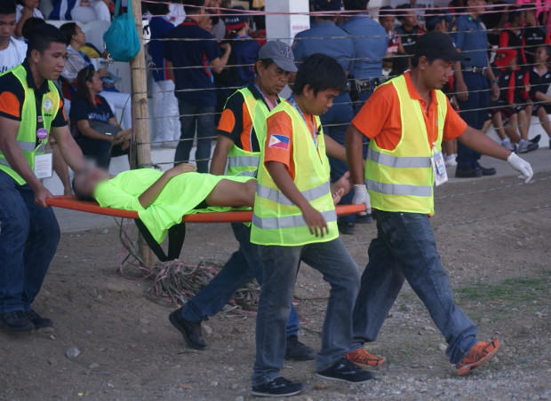 A performer during the opening rites of the Palarong Pambansa is carried out of the stadium in San Jose, Antique, on Apr. 23, 2017, after fainting. (PHOTO BY ALBERT MAMORA, CONTRIBUTOR / INQUIRER VISAYAS) 