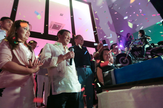President Rodrigo Roa Duterte gives a message after Former President and Incumbent Pampanga Second District Representative Gloria Arroyo presented to him a birthday cake during the former President's 70th birthday celebration at La Vista Subdivision in Quezon City on April 5, 2017. The President celebrated his 72nd birthday on March 28, 2017. Also in the photo is President Duterte's partner Honeylet Avanceña and the former President's husband Jose Miguel Arroyo. ALBERT ALCAIN/Presidential Photo