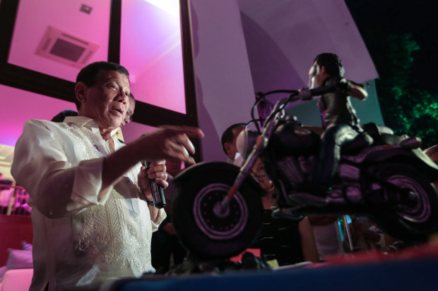 President Rodrigo Roa Duterte gives a message after Former President and Incumbent Pampanga Second District Representative Gloria Arroyo presented to him a birthday cake during the former President's 70th birthday celebration at La Vista Subdivision in Quezon City on April 5, 2017. The President celebrated his 72nd birthday on March 28, 2017. ALBERT ALCAIN/Presidential Photo