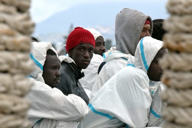 Men wait to disembark from the Italian Coast Guard vessel "Dattilo" following a rescue operation of migrants and refugees at sea, on February 1, 2016 in the port of Messina, Sicily. Over 10,000 unaccompanied migrant children have disappeared in Europe, the EU police agency Europol said yesterday, fearing many have been whisked into sex trafficking rings or the slave trade.  Europol's press office confirmed to AFP the figures published in British newspaper The Observer, adding that they covered the last 18-24 months.  AFP PHOTO / GIOVANNI ISOLINO / AFP PHOTO / GIOVANNI ISOLINO
