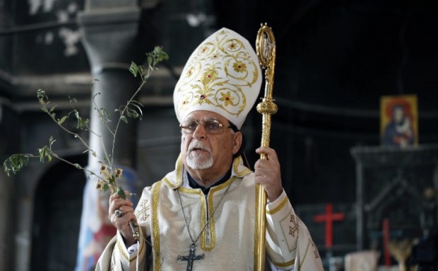 Syrian Catholic Archbishop of Mosul Yohanna Petros Mouche speaks during the Palm Sunday sermon for Iraqi Christian residents of Qaraqosh (also known as Hamdaniya), some 30 kilometres east of Mosul on April 9, 2017 after it was retaken by Iraqi forces from Islamic State (IS) group jihadists.  Qaraqosh, with an overwhelmingly Christian population of around 50,000 before the jihadists took over the area in August 2014, was the largest Christian town in Iraq. / AFP PHOTO / AHMAD GHARABLI