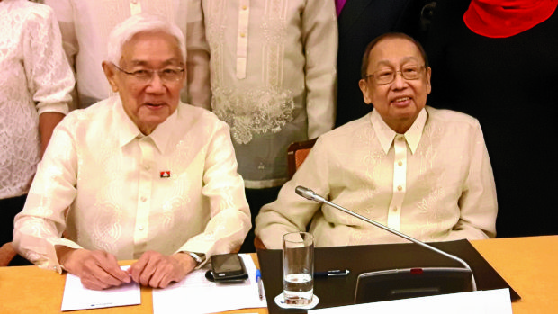 REBEL PANEL National Democratic Front of the Philippines’ senior adviser Luis Jalandoni (left) and chief political consultant Jose Maria Sison, who founded the Communist Party of the Philippines,meet members of the government panel during the opening of the fourth round of peace talks in TheNetherlands on Monday. —AFP