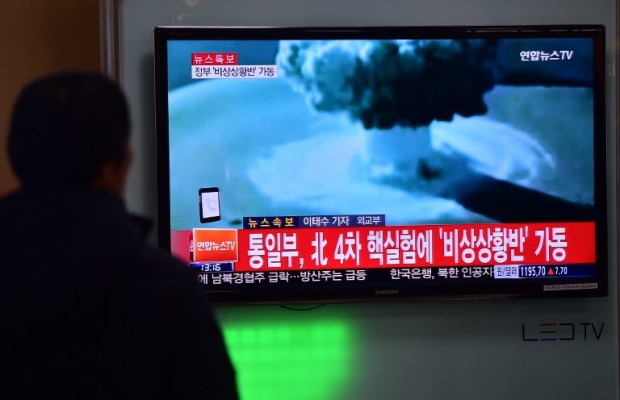ADDITION- People watch a news report on North Korea's first hydrogen bomb test at a railroad station in Seoul on January 6, 2016. South Korea "strongly" condemned North Korea's shock hydrogen bomb test and vowed to take "all necessary measures" to penalise its nuclear-armed neighbour.  The image shown on TV shows files images from other nuclear tests from other countries and the caption in red at the bottom of the screen reads "the Blue House will convene an emergency meeting of the NSC, the National Security Council."   AFP PHOTO / JUNG YEON-JE / AFP PHOTO / JUNG YEON-JE
