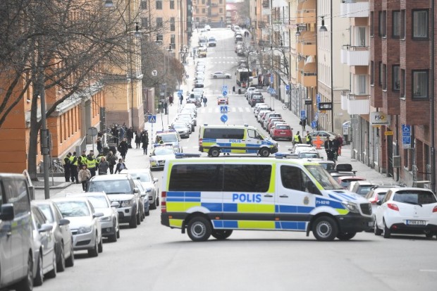 Police vans block the street outside Stockholm District Court as Uzbek national Rakhmat Akilov, prime suspect in Friday's truck attack, appeared in court on April 11, 2017. 39-year-old Uzbek national Akilov suspected of mowing down a crowd of people on a busy Stockholm street in a stolen truck admitted committing "a terrorist crime," his lawyer said. AFP