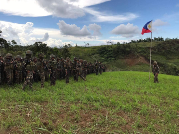 Soldiers raise PH flag in Piagapo, Lanao del Sur w/c used to be the main camp of Maute terror group. 