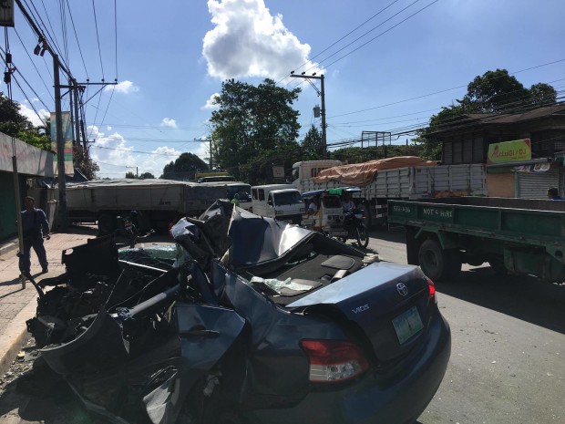 Toyota Vios driven by Orencio Taraya crumples like a tin can after it rammed into a 10-wheeler truck in Minglanilla town, southern Cebu, early Friday. Taraya died on the spot. Jose Santino Bunachita, CDN