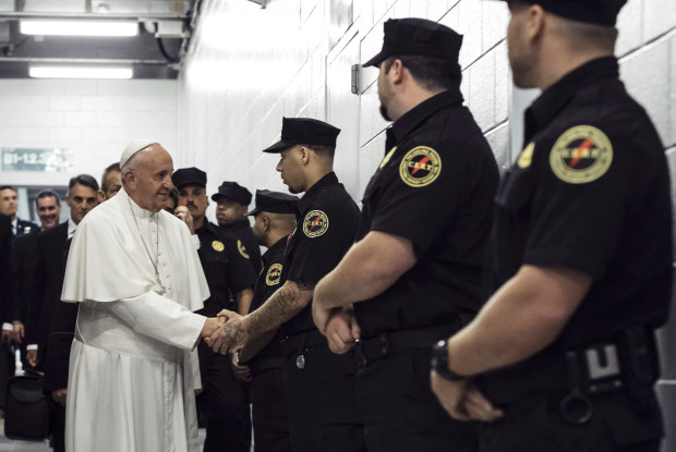 FILE - In a Sunday, Sept. 27, 2015 file photo, Pope Francis greets corrections officers at the Curran-Fromhold Correctional Facility in Philadelphia, during his visit there. A New Jersey teenager has admitted plotting to kill Pope Francis when he visited Philadelphia in 2015. Seventeen-year-old Santos Colon Jr. pleaded guilty as an adult Monday, April 3, 2017, to attempting to provide material support to terrorists. The Lindenwold resident faces up to 15 years in prison. (Todd Heisler/The New York Times, Pool)