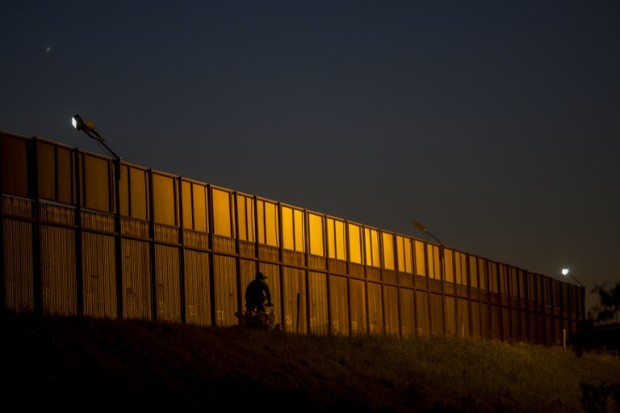 A border patrol agent drives along the US- Mexico border crossing on January 26, 2017 in San Ysidro, California. President Donald Trump has ordered work to begin on building a wall along the Mexican border, angering his southern neighbor with his hardline stance on immigration. / AFP PHOTO / DAVID MCNEW