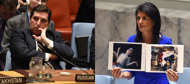 US Ambassador to the UN, Nikki Haley (right) holds photos of victims as she speaks as the UN Security Council meets in an emergency session at the UN on April 5, 2017, about the suspected deadly chemical attack that killed civilians, including children, in Syria. At left is Russian deputy UN ambassador Vladimir Safronkov as he listens to discussions at the UN Security Council meeting. AFP 