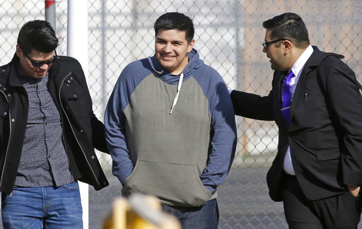 Daniel Ramirez Medina, center, walks out of the Northwest Detention Center in Tacoma, Washington, with his attorney, Luis Cortes, right, and his brother, left,  after Ramirez was released from federal custody on March 29. Ramirez had spent more than six weeks in immigration detention despite his participation in a program designed to prevent the deportation of those brought to the US illegally as children. (AP)