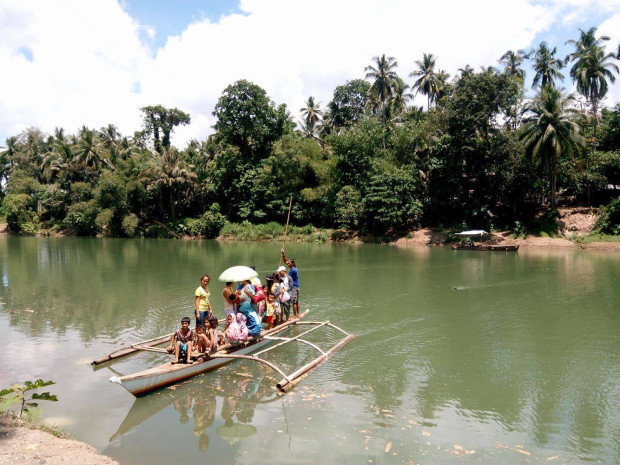 RESIDENTS of Barangay Napo, Inabanga town, Bohol flee their homes amid heavy artillery firing between the government troopers and armed men. Leo Udtohan, INQ