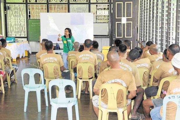 Widmann talks about the endangered bird to prisoners at the Iwahig Prison and Penal Farm in Palawan (above). —CONTRIBUTED PHOTOS