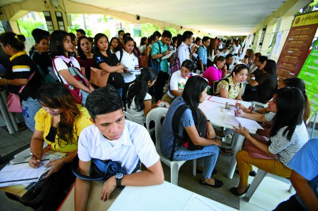 Job seekers gather at Quezon City Hall grounds during the Lador Day Job and Business Fair. INQUIRER PHOTO / NINO JESUS ORBETA
