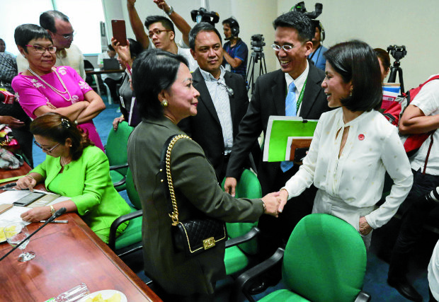 BEFORE THE REJECTION Former Environment Secretary Gina Lopez (right) shakes hands with Occidental Mindoro Rep. Josephine Sato, amember of the Commission on Appointments, who later voted against her confirmation. —GRIGMONTEGRANDE