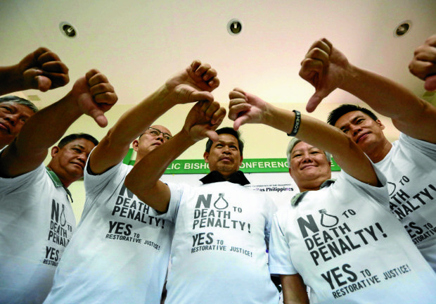 NO TO DEATH PENALTY Running priest Fr. Robert Reyes  (third from left) thumbs down death penalty during a  press conference with Church leaders at the headquarters of the Catholic Bishops Conference of the Philippines  in Intramuros,  Manila, on Friday.—MARIANNE BERMUDEZ