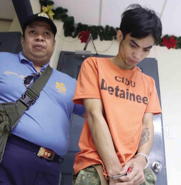 CLEARED OF MURDER, BUSTED FOR DRUGS Rafanan refused to answer questions from the press when presented at Camp Karingal on Saturday.—NIÑO JESUS ORBETA 
