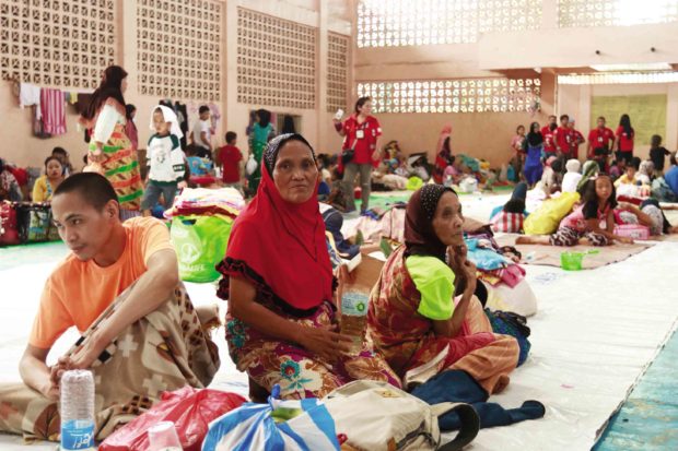 SAFE HAVEN People displaced by the fighting in Marawi City are safe at   Gomampong D. Ali Cultural Center in Baloi town in nearby Lanao del Norte province, but they need more food, water, kitchen utensils and sleeping kits.  —CAI PANLILIO