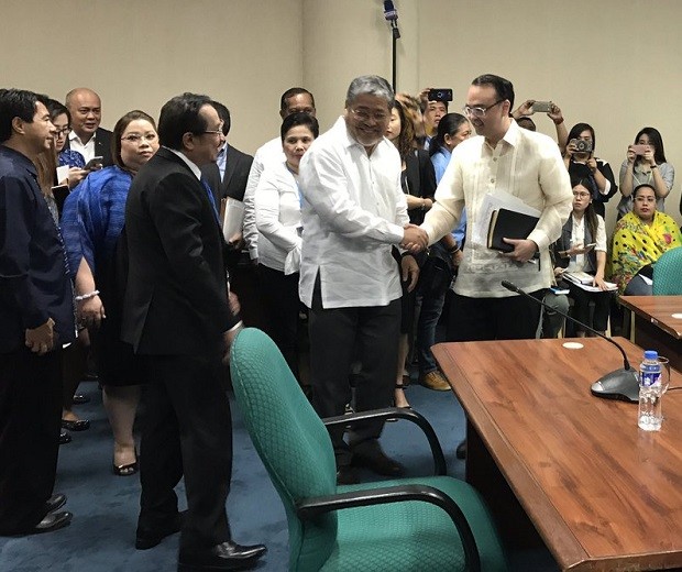 Senator Alan Peter Cayetano (right) is congratulated by Acting Foreign Affairs Secretary Enrique Manalo after a Commission on Appointments panel approved his appointment on Wednesday, May 17, 2017. MAILA AGER / INQUIRER.NET