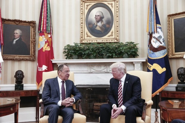 A handout photo made available by the Russian Foreign Ministry on May 10, 2017 shows US President Donald J. Trump (R) speaking with Russian Foreign Minister Sergei Lavrov during a meeting at the White House in Washington, DC. US President Donald Trump on May 10 called on Russia to rein in Syrian President Bashar al-Assad and his key ally Iran, as Washington and Moscow sought to boost their fragile ties with high-profile White House talks. Russian Foreign Minister Sergei Lavrov, the highest-ranking Russian official to visit Washington since Trump came to power in January, earned a rare invitation to the Oval Office for a head-to-head with the Republican president.  / AFP PHOTO / RUSSIAN FOREIGN MINISTRY / HO