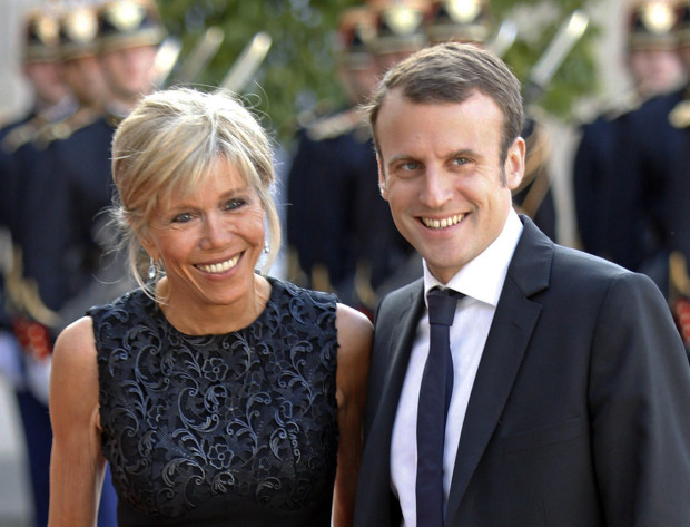 NEWCOVER STARS With Barack and Michelle Obama no longer in theWhite House, Emmanuel and Brigitte Macron are the new cover stars in the corridors of power in France. —AP