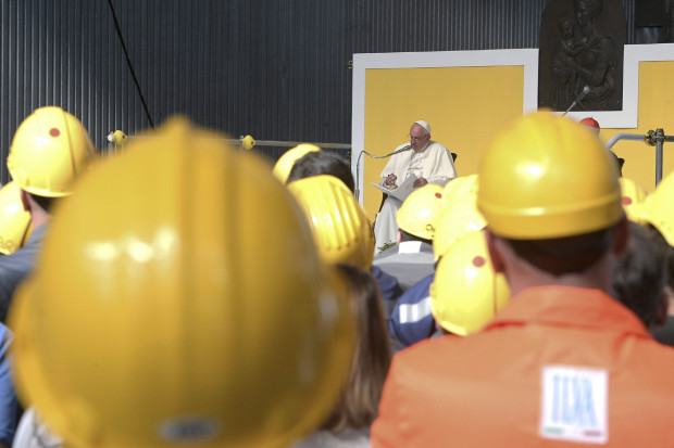 Pope Francis speaks at the ILVA steel-making company in Genoa, Italy, Saturday, May 27, 2017. Pope Francis has begun a one-day visit to the northern Italian port city of Genoa to meet with workers, poor and homeless people, refugees and prisoners (L'Osservatore Romano/Pool Photo via AP)