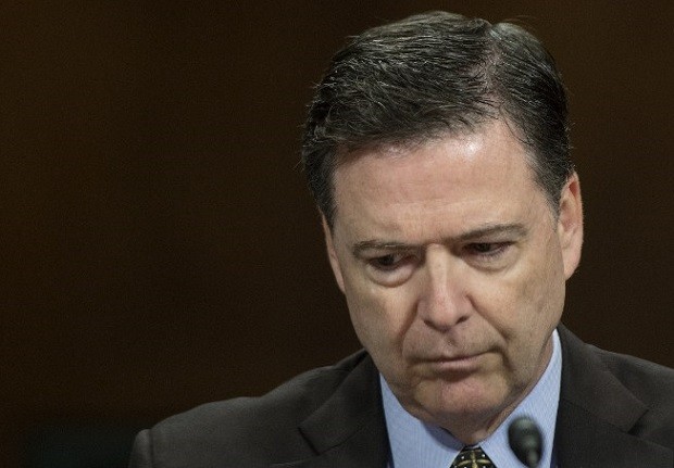(FILES) This file photo taken on May 3, 2017 shows FBI Director James Comey as he testifies before the Senate Judiciary Committee on Capitol Hill in Washington, DC. US President Donald Trump on May 9, 2017 made the shock decision to fire his FBI director James Comey, the man who leads the agency charged with investigating his campaign's ties with Russia."The president has accepted the recommendation of the Attorney General and the deputy Attorney General regarding the dismissal of the director of the Federal Bureau of Investigation," White House spokesman Sean Spicer told reporters.  / AFP PHOTO / JIM WATSON