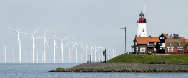 A picture taken on June 21, 2016 shows windmills at the new wind farm in Urk, The Netherlands.  The forty-eight wind turbines of the largest near-shore wind farm in the Netherlands generate an amount of renewable energy that is comparable to the consumption of 160,000 households.  / AFP PHOTO / ANP / Remko de Waal / Netherlands OUT