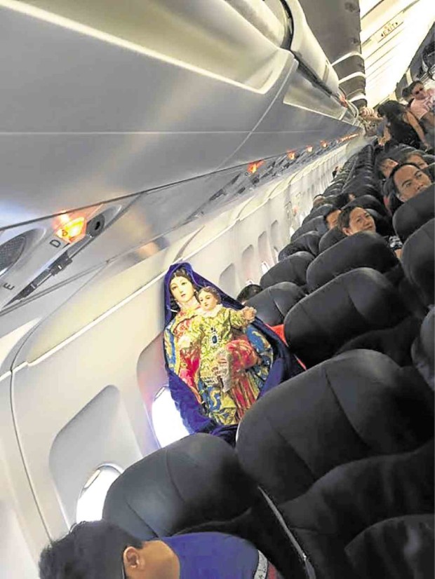 Angeles has been taking trips to the provinces with his image of Mary Help of Christians, which once became his airplane seatmate on a flight to Cebu.